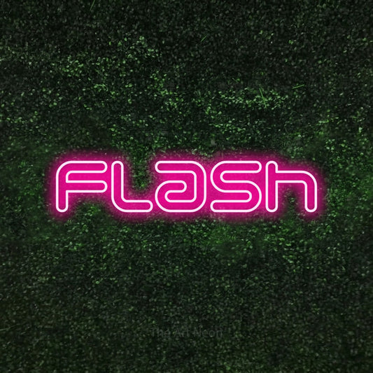 Hot pink outline-style LED neon sign reading "Flash" against a textured green moss wall for tattoo studio décor