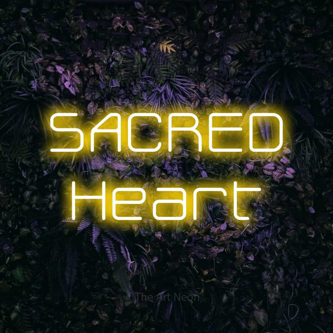 Yellow LED neon sign reading "Sacred Heart" against a purple floral wall for tattoo studio décor
