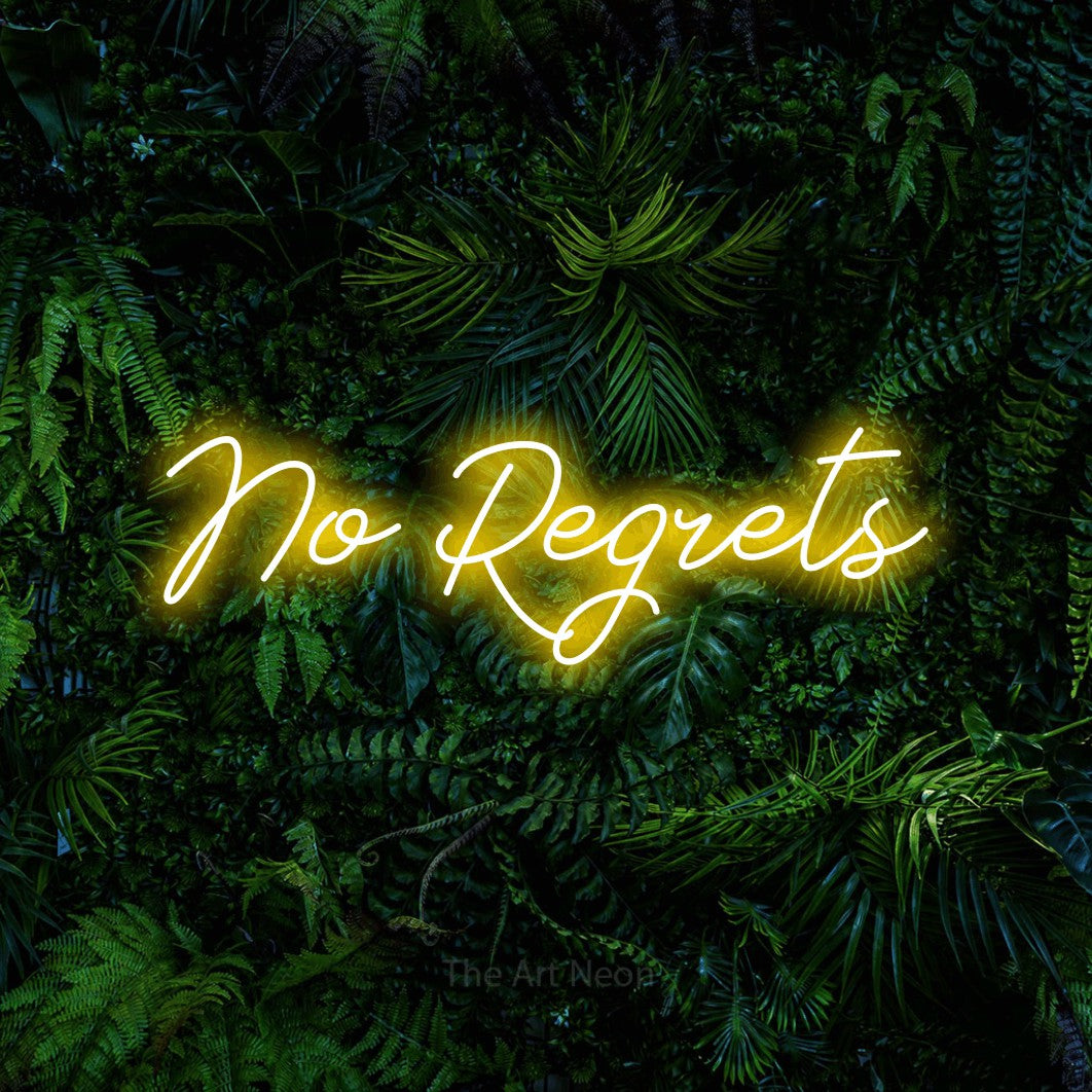 Yellow script-style LED neon sign reading "No Regrets" against a dense tropical foliage wall for tattoo studio décor
