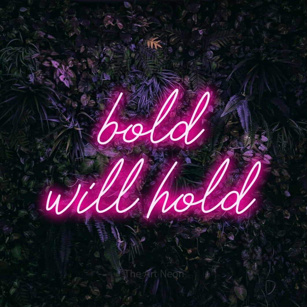 Hot pink script-style LED neon sign reading "Bold Will Hold" against a purple floral wall for tattoo studio décor
