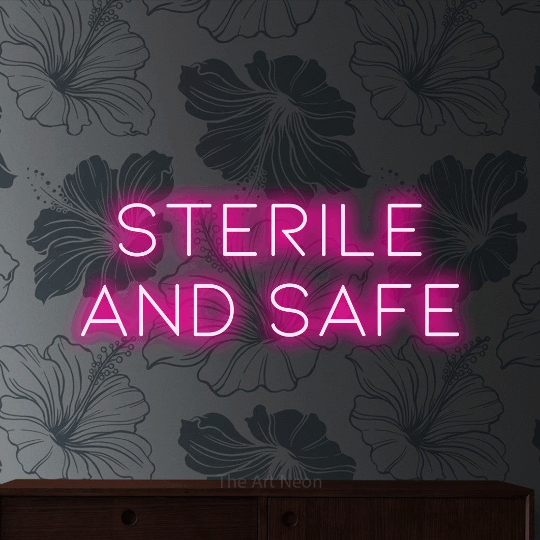 Enseigne néon à DEL à lumière rose vif, affichant « Sterile and Safe » sur un papier peint floral gris, pour décorer un studio de tatouage