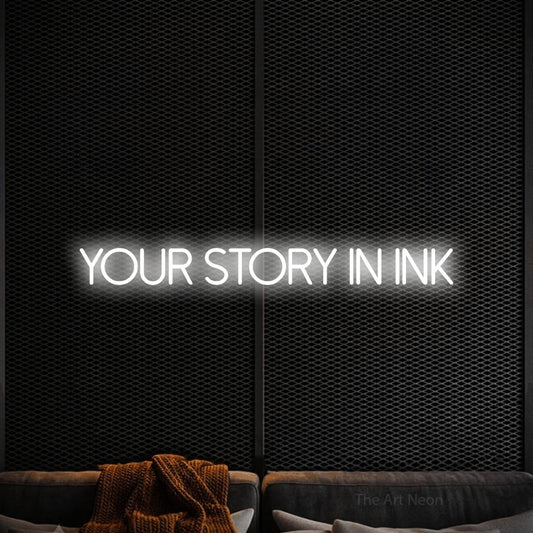 Cool white LED neon sign reading "Your Story in Ink" against a black textured wall for tattoo studio décor