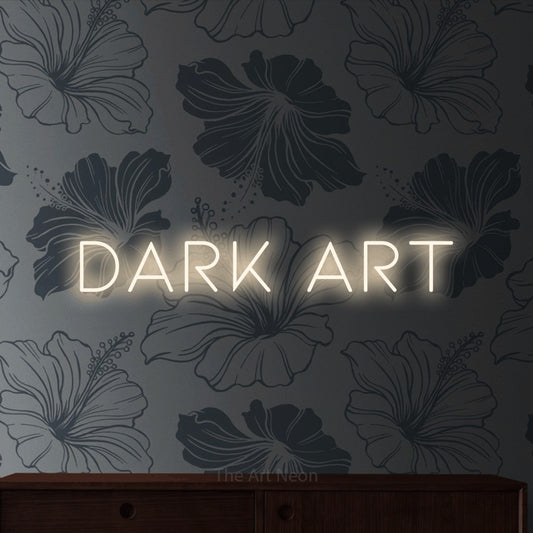 Warm white LED neon sign reading "Dark Art" against grey floral wallpaper for tattoo studio décor