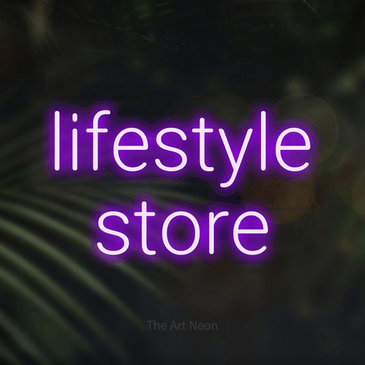 Purple LED neon sign reading "Lifestyle Store" against dark blurred palm leaves