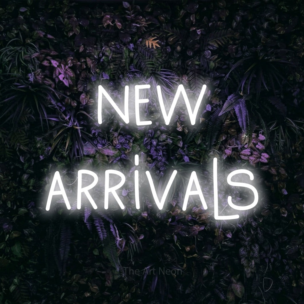 Cool white LED neon sign reading "New Arrivals" against a purple floral wall