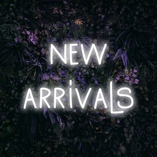 Cool white LED neon sign reading "New Arrivals" against a purple floral wall