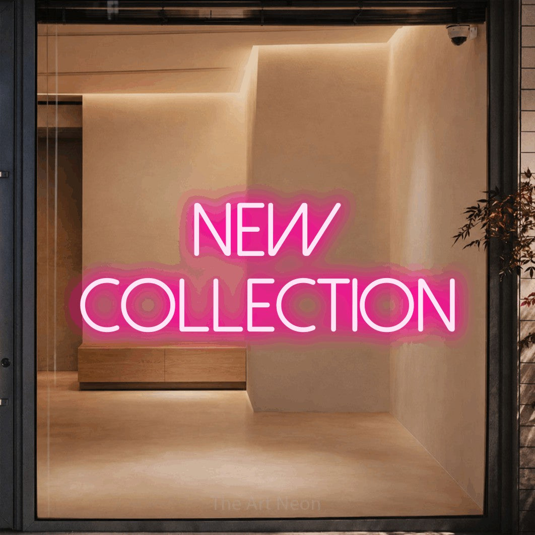Hot pink LED neon sign reading "New Collection" against a warm beige alcove wall