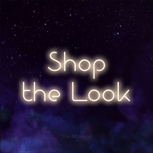 Warm white LED neon sign reading "Shop the Look" against a purple galaxy background