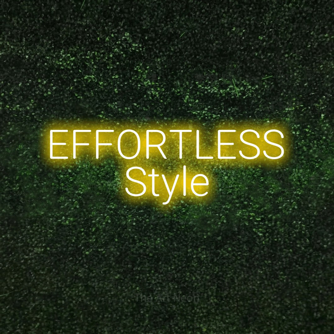 Yellow LED neon sign reading "Effortless Style" against a textured green moss wall
