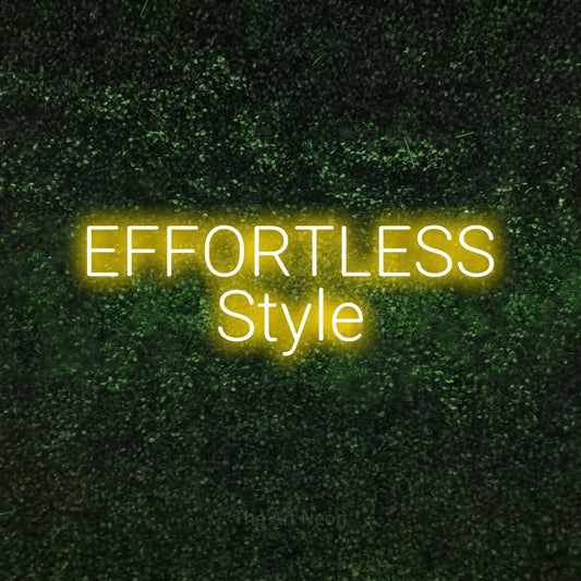Yellow LED neon sign reading "Effortless Style" against a textured green moss wall