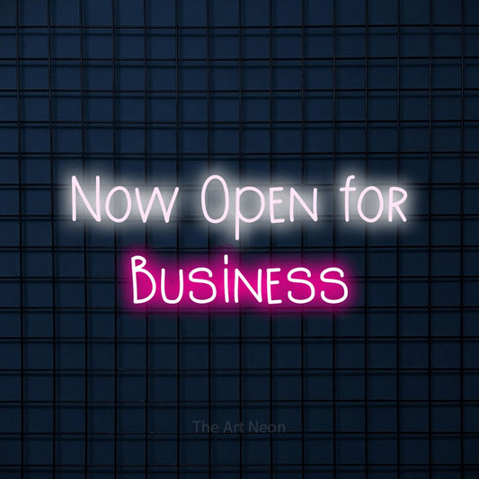 Hot pink and cool white LED neon sign reading "Now Open for Business" against a dark blue tiled wall for office décor