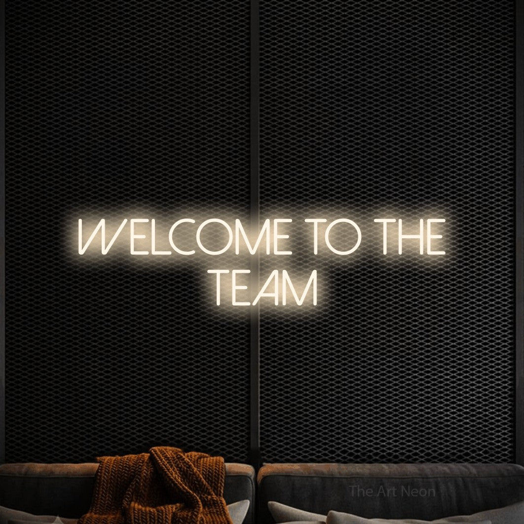 Warm white LED neon sign reading "Welcome to the Team" against a black textured wall for office décor