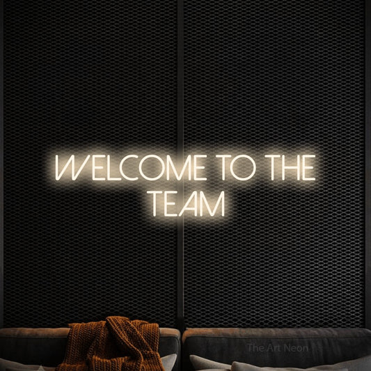 Warm white LED neon sign reading "Welcome to the Team" against a black textured wall for office décor