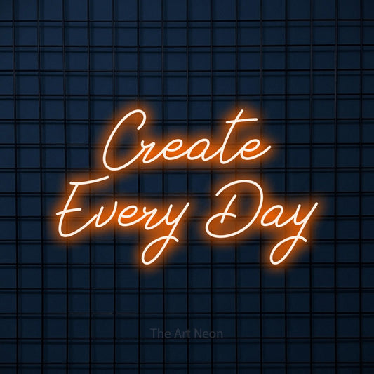 Orange script-style LED neon sign reading "Create Every Day" against a dark blue tiled wall for office décor