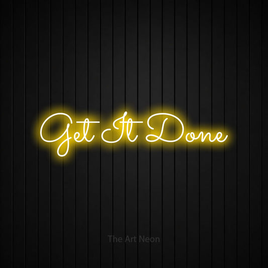 Yellow LED neon sign reading "Get It Done" against a black vertical slat wall for office décor