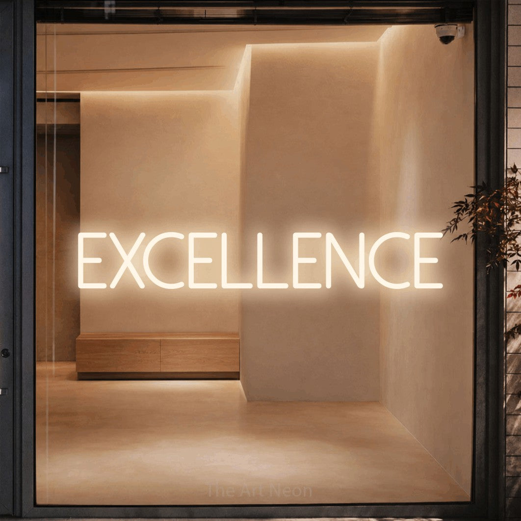 Warm white LED neon sign reading "Excellence" against a warm beige alcove wall for office décor