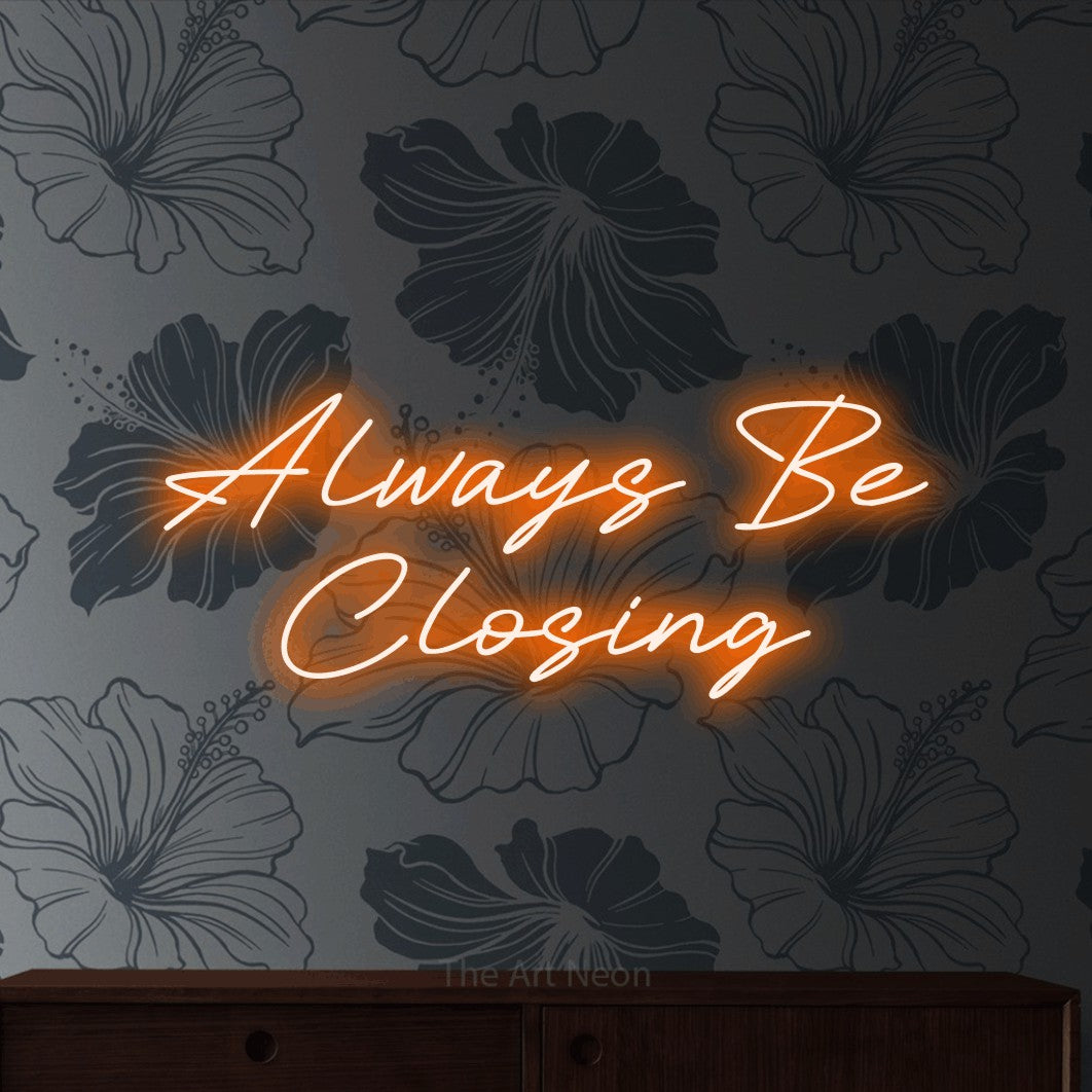 Orange LED neon sign reading "Always Be Closing" against grey floral wallpaper for office décor