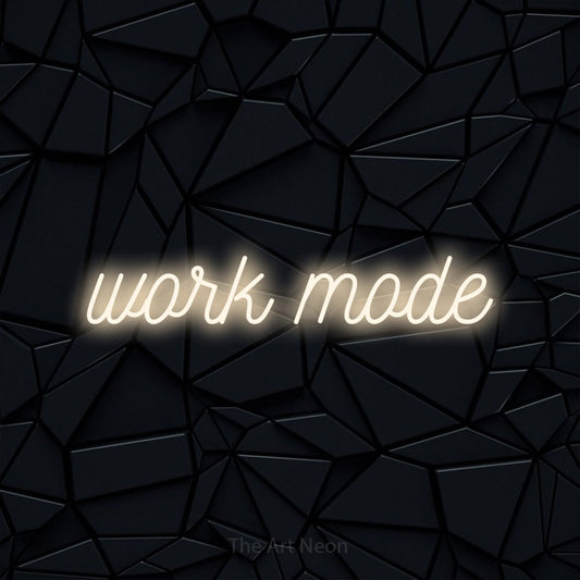 Warm white script-style LED neon sign reading "Work Mode" against a black faceted wall for office décor
