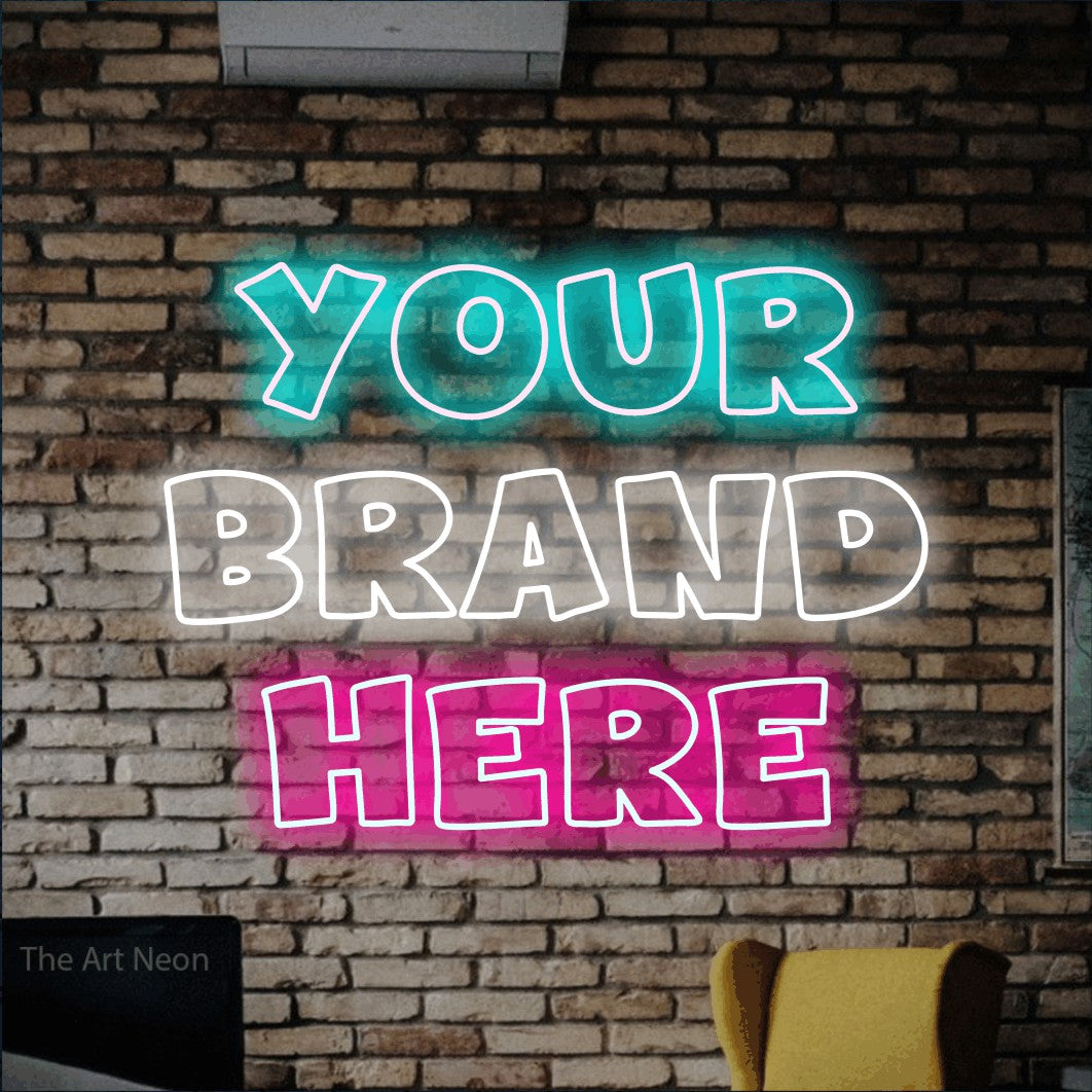 Multicolour outline-style LED neon sign reading "Your Brand Here" against a rustic brick wall for office décor