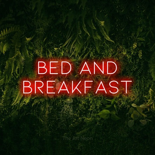 Red LED neon sign reading "Bed and Breakfast" against a moss-covered green wall for hotel décor