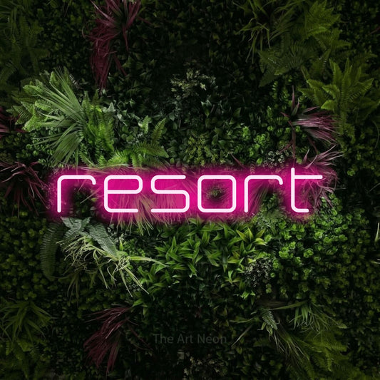 Hot pink LED neon sign reading "Resort" against a lush garden wall with pink flowers for hotel décor