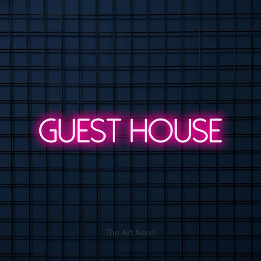 Hot pink LED neon sign reading "Guest House" against a dark blue tiled wall for hotel décor