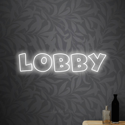Cool white outline-style LED neon sign reading "Lobby" against light grey floral wallpaper for hotel décor