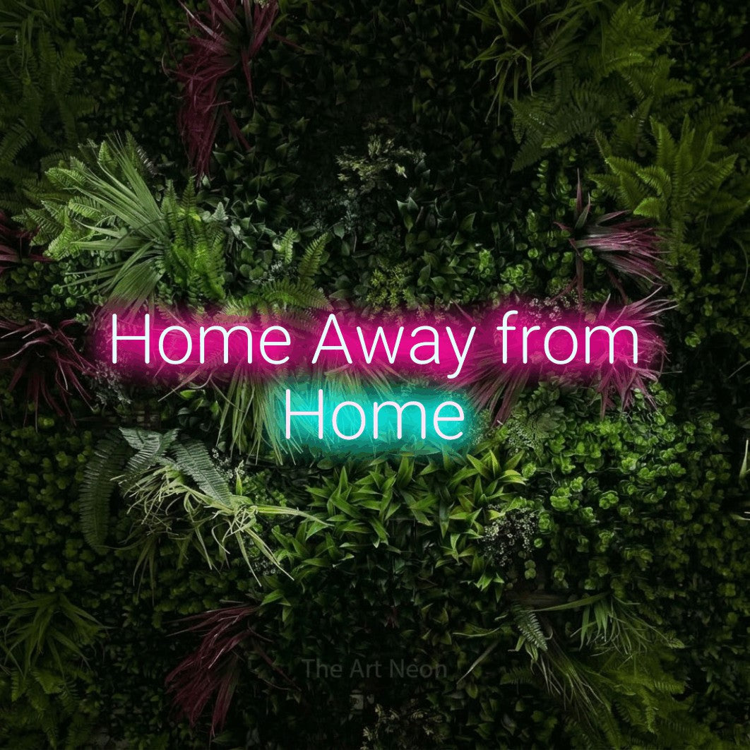 Ice blue and hot pink LED neon sign reading "Home Away from Home" against a lush garden wall with pink flowers