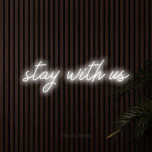 Cool white script-style LED neon sign reading "Stay with Us" against dark wooden slats for hotel décor