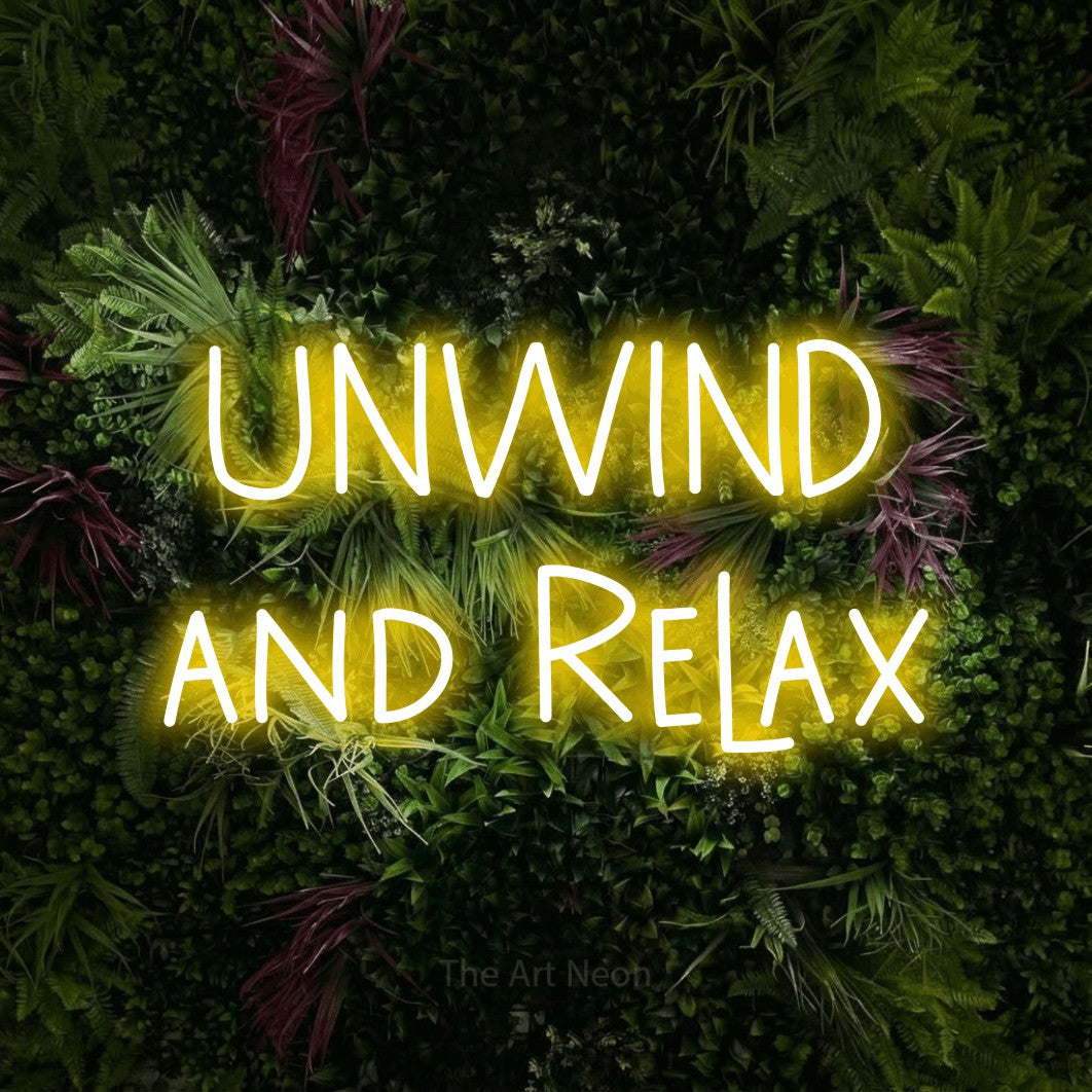 Yellow LED neon sign reading "Unwind and Relax" against a lush garden wall with pink flowers for hotel décor