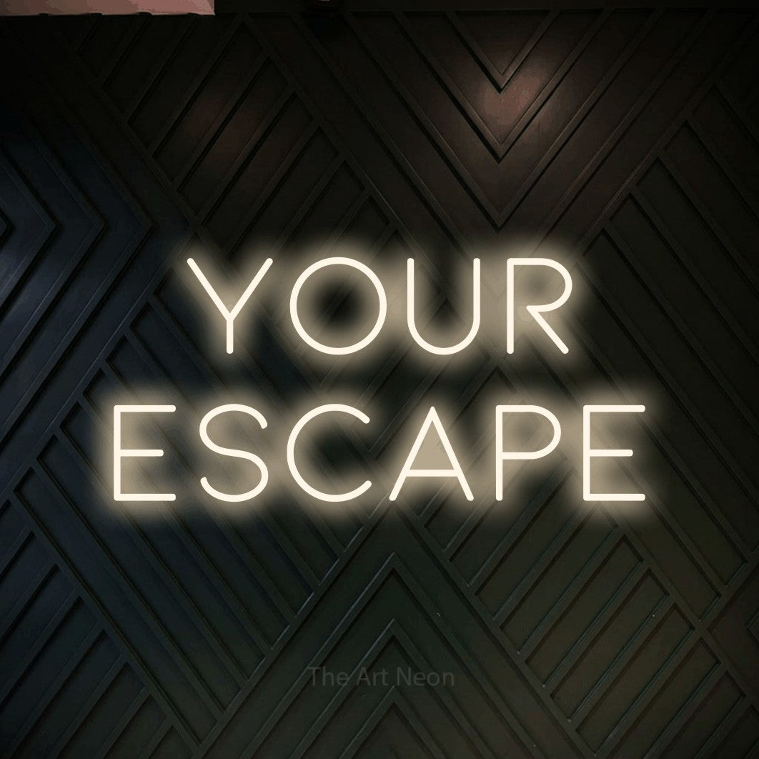 Warm white LED neon sign reading "Your Escape" against a dark geometric wood wall for hotel décor