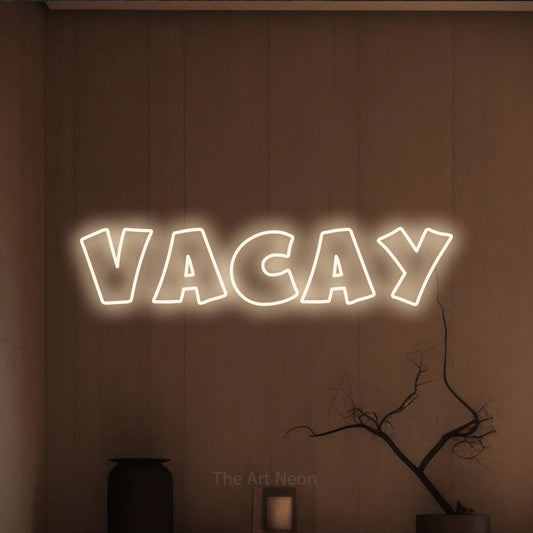 Warm white outline-style LED neon sign reading "Vacay" against a warm brown wall for hotel décor