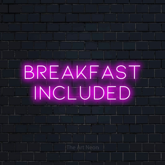 Pink LED neon sign reading "Breakfast Included" against a dark navy brick wall for hotel décor