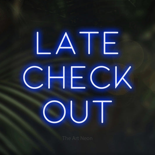 Blue LED neon sign reading "Late Check Out" against dark blurred palm leaves for hotel décor