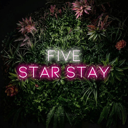 Hot pink and cool white LED neon sign reading "Five Star Stay" against a flowering garden wall for hotel décor