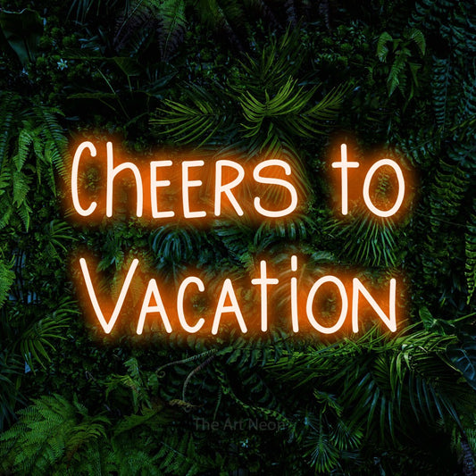 Orange LED neon sign reading "Cheers to Vacation" against a dense tropical foliage wall for hotel décor