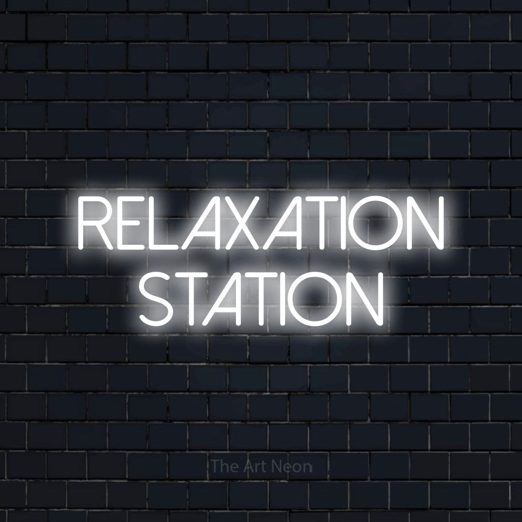 Cool white LED neon sign reading "Relaxation Station" against a dark navy brick wall for hotel décor
