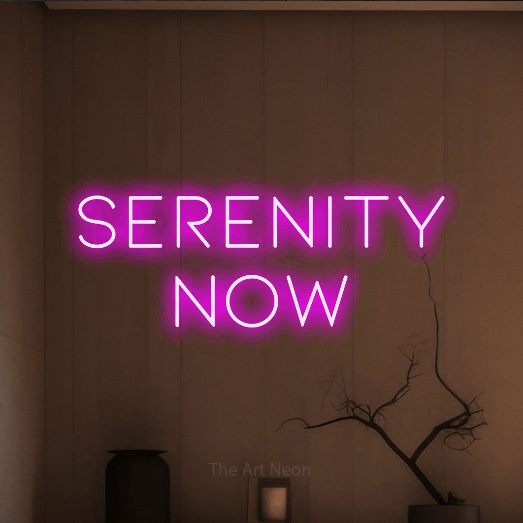 Pink LED neon sign reading "Serenity Now" against a warm brown wall for hotel décor