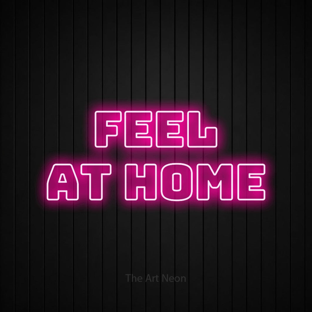 Hot pink outline-style LED neon sign reading "Feel at Home" against a black vertical slat wall for hotel décor