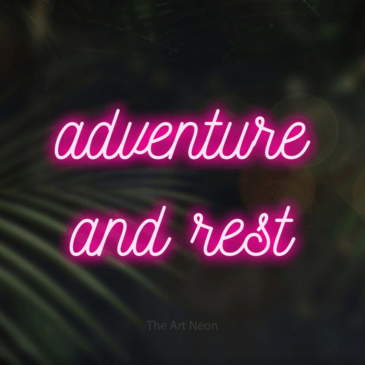 Hot pink script-style LED neon sign reading "Adventure and Rest" against dark blurred palm leaves for hotel décor