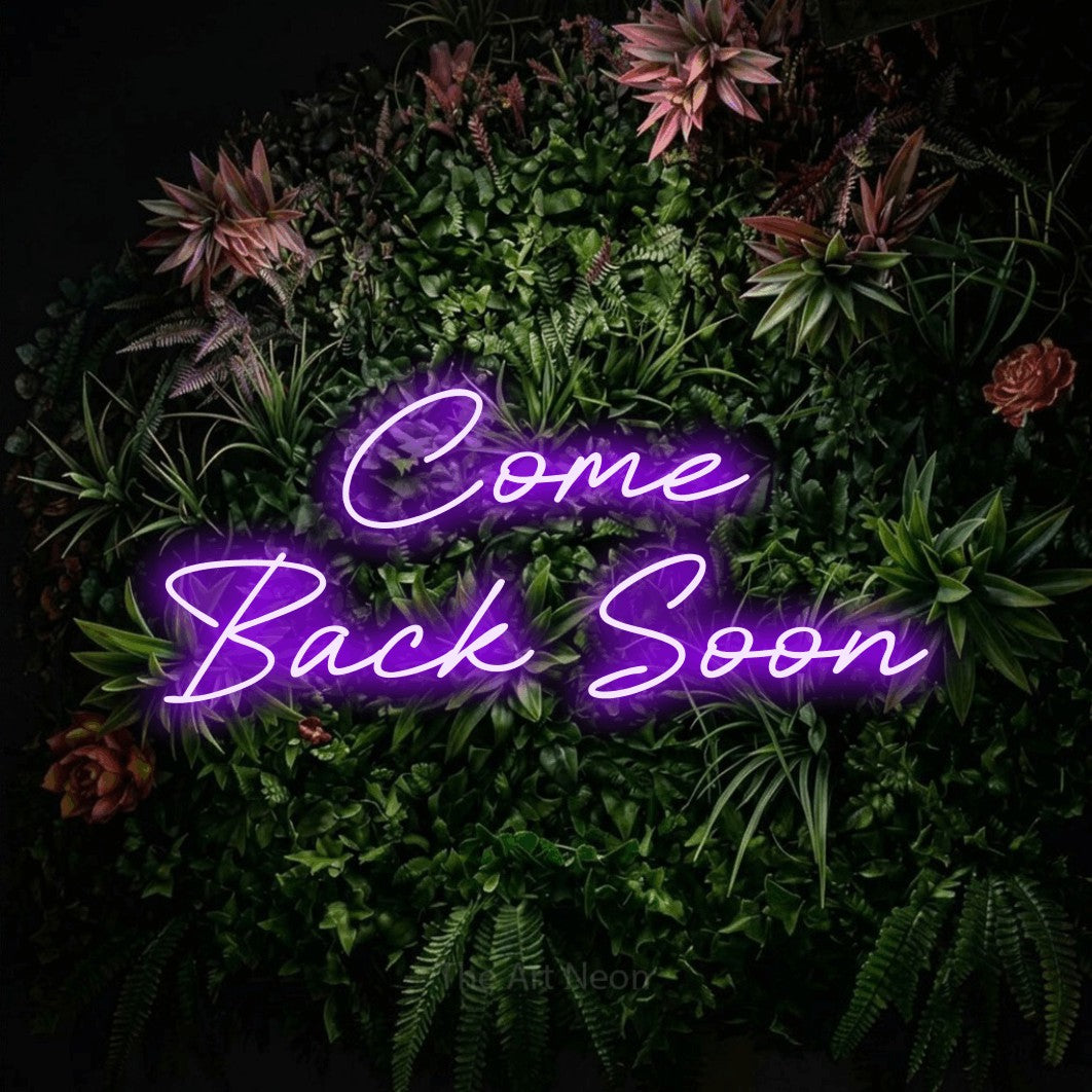 Purple LED neon sign reading "Come Back Soon" against a flowering garden wall for hotel décor