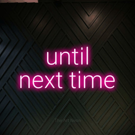 Hot pink LED neon sign reading "Until Next Time" against a dark geometric wood wall for hotel décor