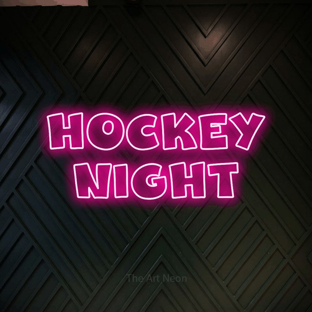 Hot pink outline-style LED neon sign reading "Hockey Night" against a dark geometric wood wall