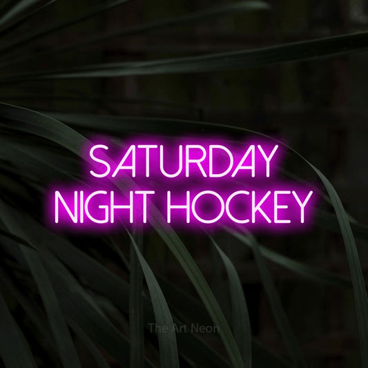 Enseigne néon à DEL à lumière rose, affichant « Saturday Night Hockey » sur des feuilles tropicales foncées