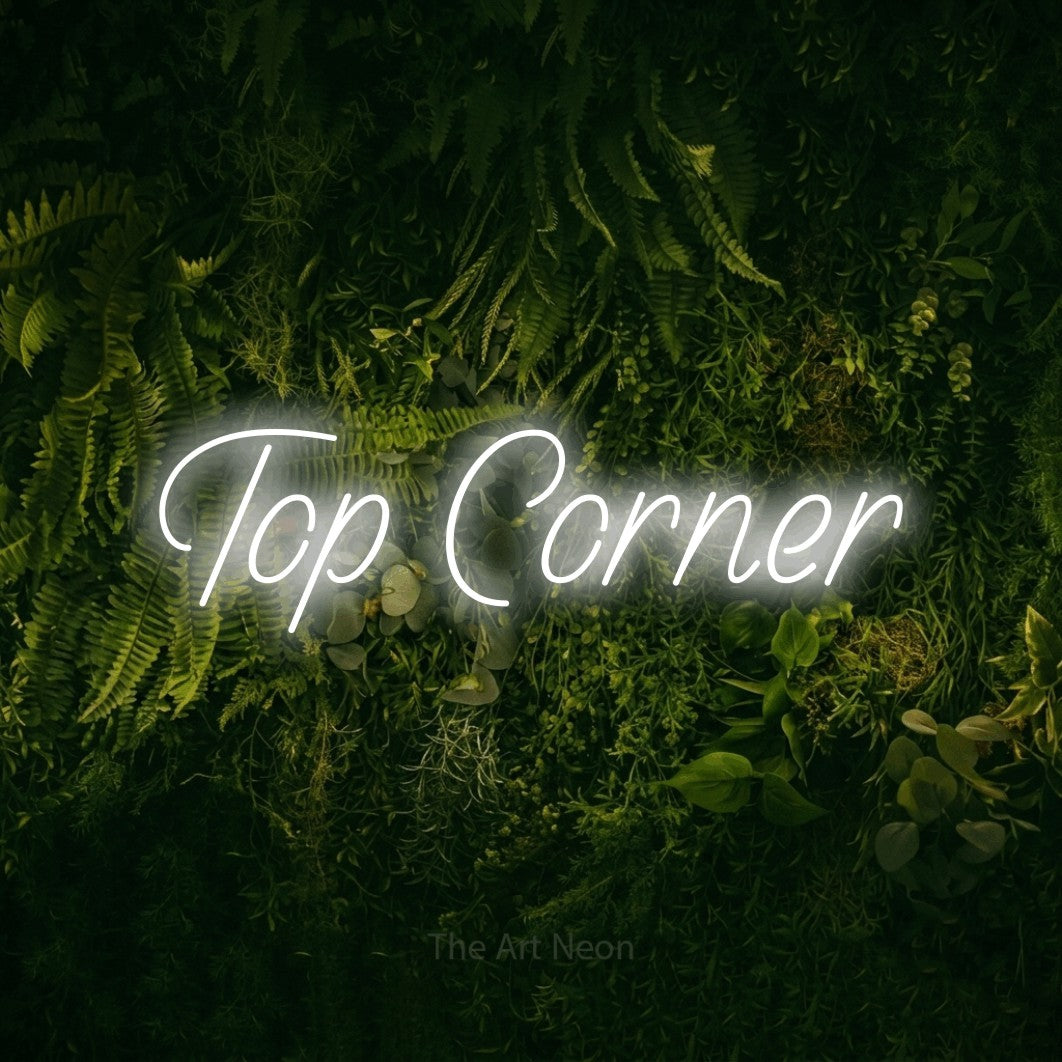 Cool white LED neon sign reading "Top Corner" against a moss-covered green wall