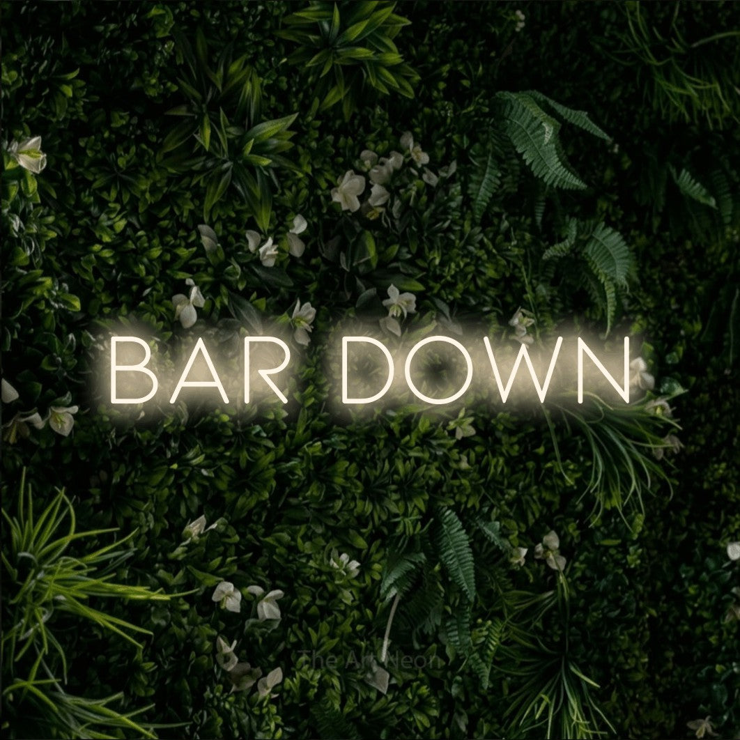 Warm white LED neon sign reading "Bar Down" against a leafy green wall