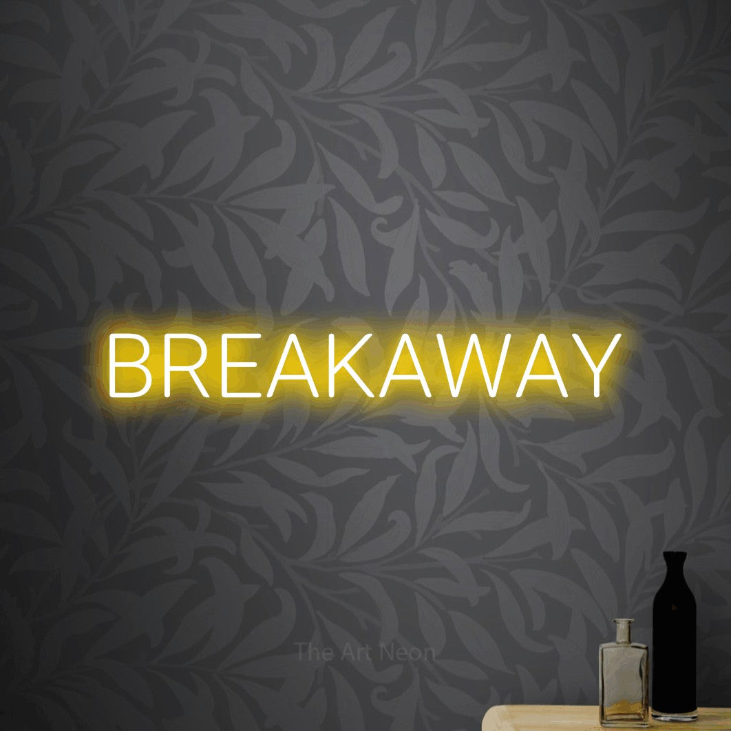 Yellow LED neon sign reading "Breakaway" against light grey floral wallpaper
