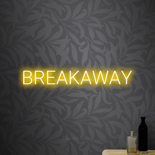 Yellow LED neon sign reading "Breakaway" against light grey floral wallpaper