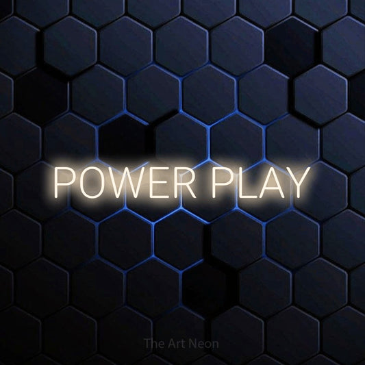 Warm white LED neon sign reading "Power Play" against a blue hexagonal wall
