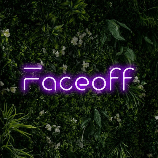 Purple LED neon sign reading "Faceoff" against a leafy green wall